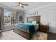 Bedroom with a large window, wooden furniture, and an elegant, inviting aesthetic at 4826 Keel Ct., Myrtle Beach, SC 29579