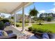 Relaxing covered front porch with comfortable seating and views of the landscaped yard at 4826 Keel Ct., Myrtle Beach, SC 29579