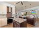 Modern kitchen with an island, stainless steel appliances, and seamless flow into the living spaces at 4826 Keel Ct., Myrtle Beach, SC 29579