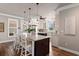 Bright kitchen with an island, granite countertops, stainless steel appliances, and warm wood flooring at 4826 Keel Ct., Myrtle Beach, SC 29579