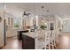 Spacious kitchen featuring a large island with seating, granite countertops, and stainless steel appliances at 4826 Keel Ct., Myrtle Beach, SC 29579