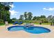 Sparkling pool with a stone hot tub surrounded by lush landscaping and comfortable lounge chairs at 4826 Keel Ct., Myrtle Beach, SC 29579