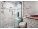 Bathroom featuring a glass enclosed shower with white marble tiles at 4853 Meadowsweet Dr. # 1805, Myrtle Beach, SC 29579