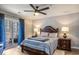 Cozy bedroom featuring a ceiling fan, balcony access, and classic furniture at 4853 Meadowsweet Dr. # 1805, Myrtle Beach, SC 29579