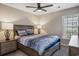 Neutral bedroom featuring natural light from the window and two bedside tables with matching lamps at 4853 Meadowsweet Dr. # 1805, Myrtle Beach, SC 29579