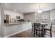 Eat-in kitchen with an island with granite countertops and wooden cabinets; seating for four at 4853 Meadowsweet Dr. # 1805, Myrtle Beach, SC 29579
