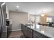 Kitchen island with granite countertops and stainless steel appliances in an open concept design at 4853 Meadowsweet Dr. # 1805, Myrtle Beach, SC 29579