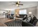Open concept living room and kitchen area with ceiling fan, sofas, accent rug, and eat-in kitchen at 4853 Meadowsweet Dr. # 1805, Myrtle Beach, SC 29579
