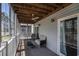 Screened porch with wooden ceiling, ceiling fan, outdoor seating, and views of the surrounding scenery at 4853 Meadowsweet Dr. # 1805, Myrtle Beach, SC 29579