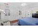 Bright bedroom featuring a queen-sized bed, built-in storage, hardwood floors, and ample closet space at 515 River Rd., Conway, SC 29526