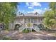 Spacious two-story home featuring a large screened porch and inviting entry stairs at 515 River Rd., Conway, SC 29526