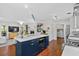 Open kitchen features island with white countertop and stainless steel appliances at 515 River Rd., Conway, SC 29526