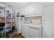Well-organized laundry room with white cabinetry, modern appliances, and ample storage space at 515 River Rd., Conway, SC 29526