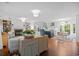 Spacious living room flowing into the kitchen and dining area, featuring hardwood floors and bright light at 515 River Rd., Conway, SC 29526