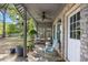 Inviting brick patio with a cozy seating area under a latticed roof and ceiling fan at 515 River Rd., Conway, SC 29526