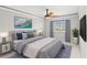 Well-decorated bedroom with a plush bed, decorative paintings, and views of the neighborhood at 528 Chamberlin Rd., Myrtle Beach, SC 29588