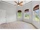 Bright bedroom features wood floors, large windows and trim, and ceiling fan at 528 Chamberlin Rd., Myrtle Beach, SC 29588
