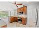 Charming kitchen features wood cabinets, stainless steel appliances, and granite countertops at 528 Chamberlin Rd., Myrtle Beach, SC 29588