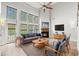 Comfortable living room features a fireplace, soaring ceilings, many windows and stylish furniture at 528 Chamberlin Rd., Myrtle Beach, SC 29588