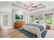 Relaxing primary bedroom with beautiful decor, a king-size bed, and an en-suite bathroom at 528 Chamberlin Rd., Myrtle Beach, SC 29588