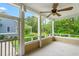 Spacious porch with views of a serene backyard landscape and lush trees at 528 Chamberlin Rd., Myrtle Beach, SC 29588
