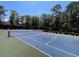 Community blue tennis court with green border and netting at 528 Chamberlin Rd., Myrtle Beach, SC 29588