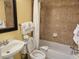 Cozy bathroom features a shower-tub combo with tile surround, sink, and toilet at 5300 N Ocean Blvd. # 306, Myrtle Beach, SC 29577