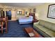 Comfortable bedroom features a sofa, breakfast table, and access to a bathroom and kitchen at 5300 N Ocean Blvd. # 306, Myrtle Beach, SC 29577