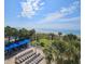 Beautiful view of beach, ocean, and blue canopies from high vantage point at 5300 N Ocean Blvd. # 306, Myrtle Beach, SC 29577
