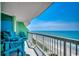 Charming balcony view with Adirondack chairs overlooking the beach and Atlantic ocean at 5310 N Ocean Blvd. # 10B, North Myrtle Beach, SC 29582