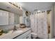 Updated bathroom with modern vanity, shower, and coastal decorations at 5310 N Ocean Blvd. # 10B, North Myrtle Beach, SC 29582
