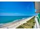 Scenic overhead beach view, capturing the sandy shore, ocean, and coastal scenery, creating a serene visual experience at 5310 N Ocean Blvd. # 10B, North Myrtle Beach, SC 29582