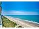 Expansive beach view from above, showing ocean waves, sandy shoreline, and a picturesque coastline at 5310 N Ocean Blvd. # 10B, North Myrtle Beach, SC 29582