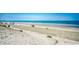 Expansive beach view with people enjoying a sunny day by the ocean at 5310 N Ocean Blvd. # 10B, North Myrtle Beach, SC 29582