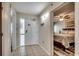 A tiled entryway leading to a bedroom with wood flooring and ceiling fan lighting at 5310 N Ocean Blvd. # 10B, North Myrtle Beach, SC 29582