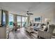 Cozy living room featuring a calming color scheme, plush seating, and floor-to-ceiling windows offering a beautiful ocean view at 5310 N Ocean Blvd. # 10B, North Myrtle Beach, SC 29582
