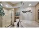 Relaxing main bathroom with shower, tub, and coastal-themed accessories at 5310 N Ocean Blvd. # 10B, North Myrtle Beach, SC 29582