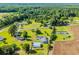 Aerial view of country home surrounded by farmland, trees, and outbuildings at 5589 Highway 668, Conway, SC 29526