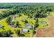 Expansive aerial view of a single-Gathering home, including a detached garage and the surrounding, lush green landscape at 5589 Highway 668, Conway, SC 29526