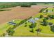 Aerial view of a country home with lush green space, farmland, and detached garage offering a peaceful setting at 5589 Highway 668, Conway, SC 29526