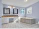 Bathroom featuring double vanity, soaking tub, tile flooring, and blue wall paint at 5589 Highway 668, Conway, SC 29526