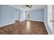 This bedroom features blue walls, hardwood floor, and a ceiling fan at 5589 Highway 668, Conway, SC 29526