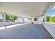 Large carport area with a concrete floor and blue shutters on the house at 5589 Highway 668, Conway, SC 29526