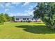 Charming single-story home with a large front yard, blue shutters, and mature landscaping at 5589 Highway 668, Conway, SC 29526