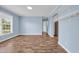 Inviting living room with wood look flooring, neutral paint, and bright natural lighting at 5589 Highway 668, Conway, SC 29526