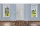 Entry featuring hard wood flooring, large windows and entry door at 5589 Highway 668, Conway, SC 29526
