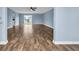 Living room with sliding glass doors, hardwood floors, and light blue walls at 5589 Highway 668, Conway, SC 29526
