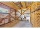 Unfinished outbuilding featuring exposed beams, a utility sink and lattice accents at 5589 Highway 668, Conway, SC 29526