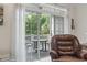 Cozy balcony area with chair and table perfect for relaxing with a view of the trees at 5750 Oyster Catcher Dr. # 822, North Myrtle Beach, SC 29582