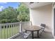 Balcony features outdoor seating overlooking lush greenery, perfect for relaxing at 5750 Oyster Catcher Dr. # 822, North Myrtle Beach, SC 29582